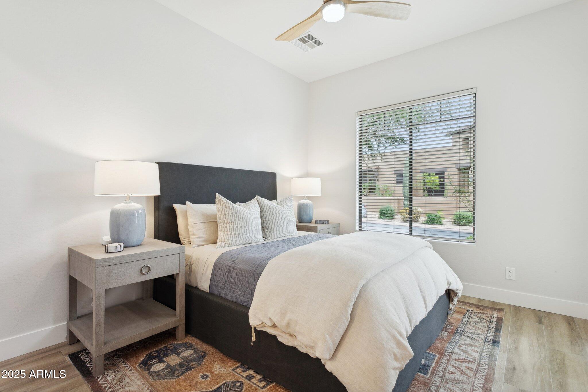 9270 East Thompson Peak Parkway, Unit 364 Scottsdale, AZ 85255 - Photo 23 of 45 a bedroom with a large bed and a window
