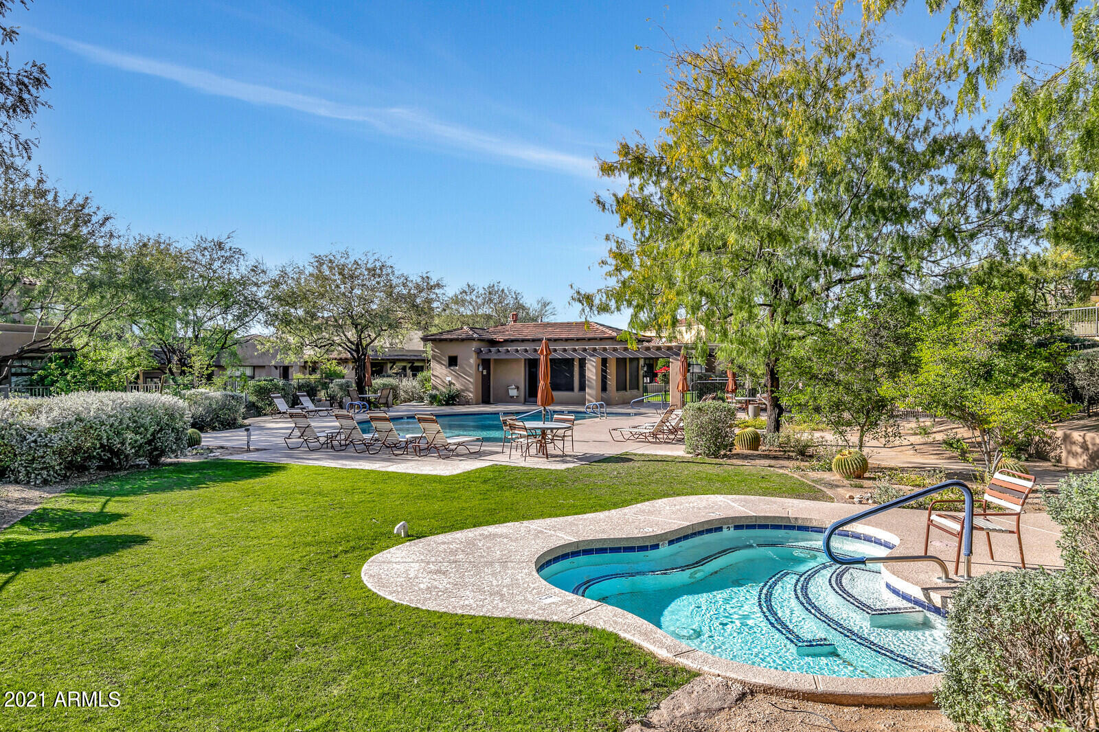 9270 East Thompson Peak Parkway, Unit 364 Scottsdale, AZ 85255 - Photo 34 of 45 a swimming pool with outdoor seating and yard