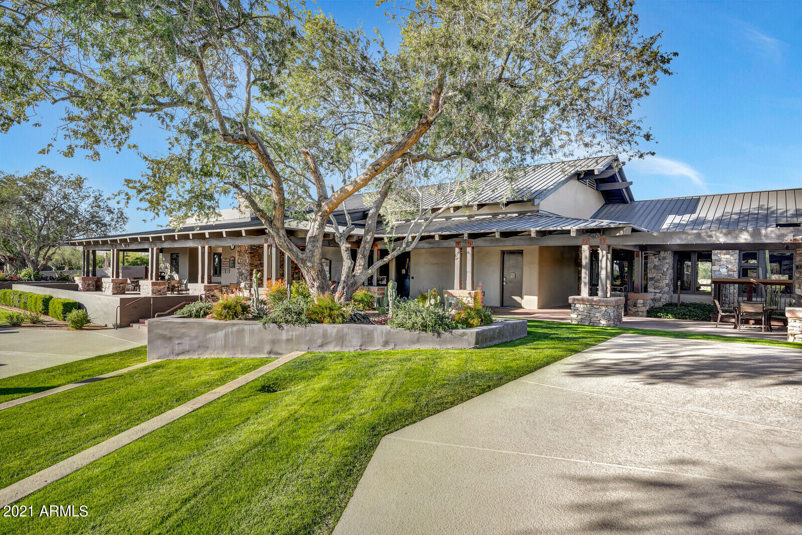 9270 East Thompson Peak Parkway, Unit 364 Scottsdale, AZ 85255 - Photo 38 of 45 a front view of a house with swimming pool having outdoor seating