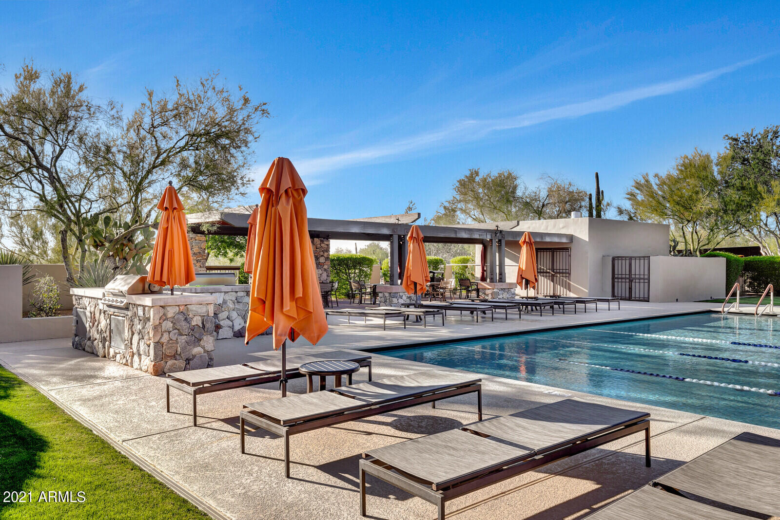 9270 East Thompson Peak Parkway, Unit 364 Scottsdale, AZ 85255 - Photo 39 of 45 a view of a patio with swimming pool table and chairs