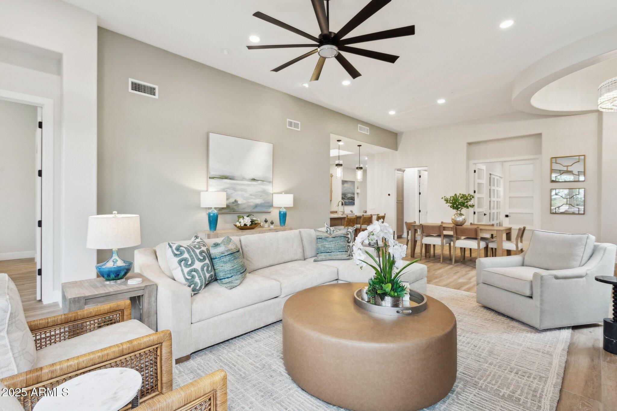 9270 East Thompson Peak Parkway, Unit 364 Scottsdale, AZ 85255 - Photo 6 of 45 a living room with furniture and a large window