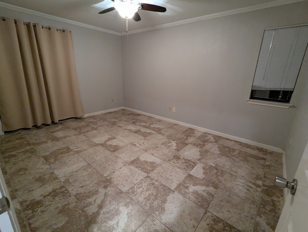 2410 Enfield Road, Unit 5 Austin, TX 78703 - Photo 11 of 17 a view of an empty room with a window