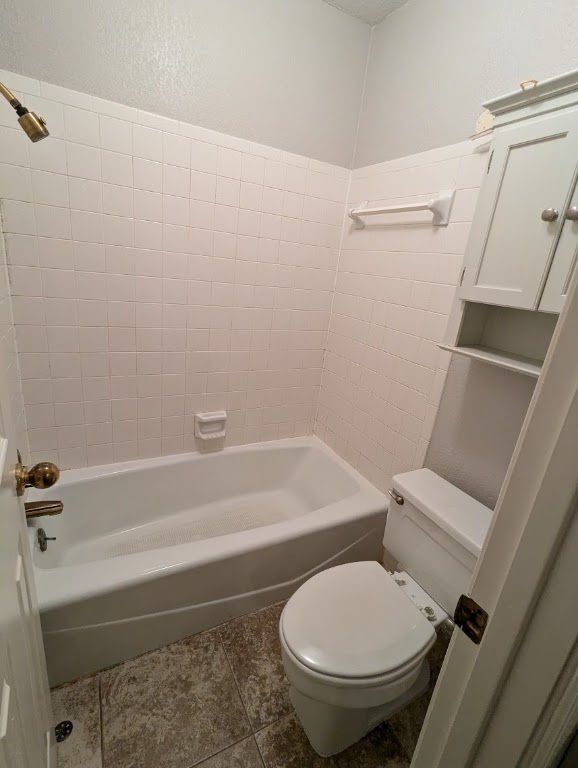 2410 Enfield Road, Unit 5 Austin, TX 78703 - Photo 15 of 17 a white toilet and tub sitting next to a bathroom sink