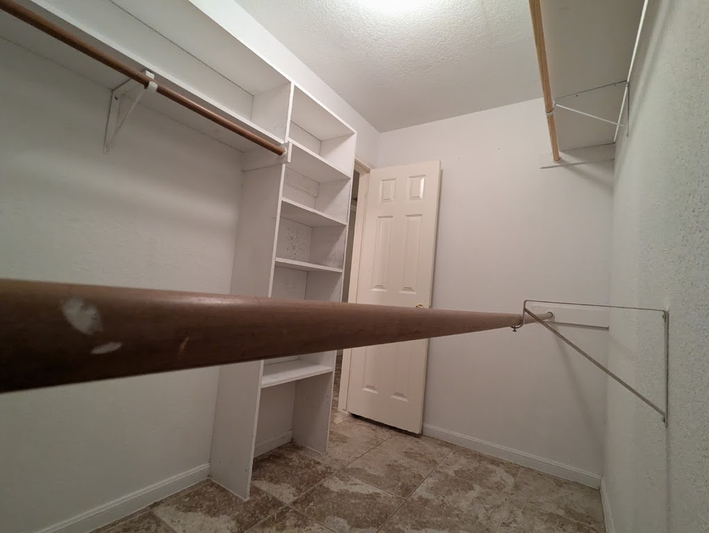 2410 Enfield Road, Unit 5 Austin, TX 78703 - Photo 16 of 17 a view of an empty walk in closet