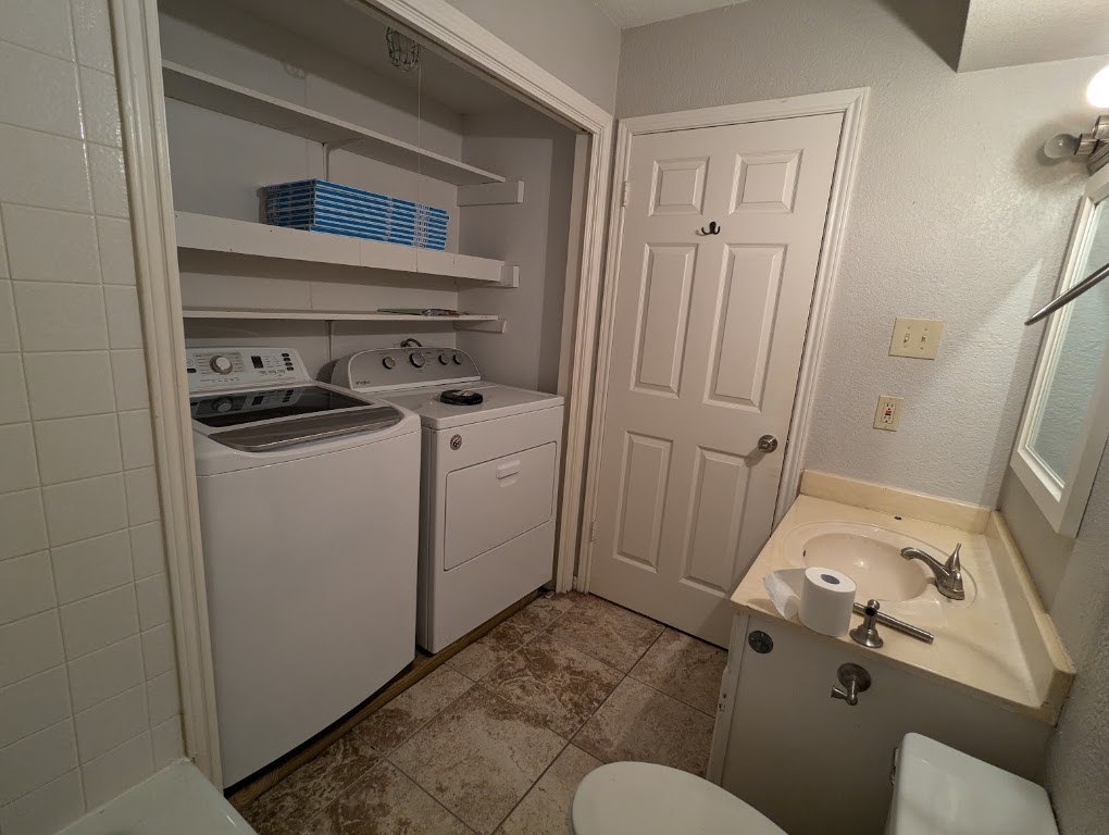 2410 Enfield Road, Unit 5 Austin, TX 78703 - Photo 17 of 17 a bathroom with a sink and toilet