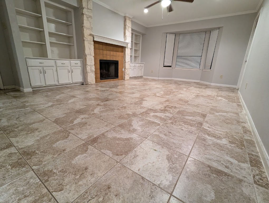 2410 Enfield Road, Unit 5 Austin, TX 78703 - Photo 8 of 17 a view of empty room with a fireplace and cabinet