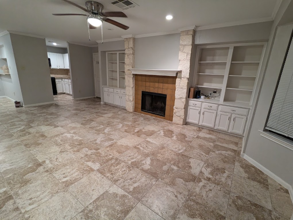 2410 Enfield Road, Unit 5 Austin, TX 78703 - Photo 9 of 17 an empty room with furniture and a fireplace