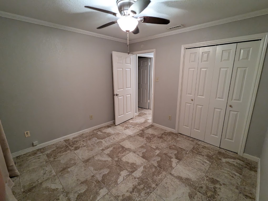 2410 Enfield Road, Unit 5 Austin, TX 78703 - Photo 10 of 17 a view of an empty room and chandelier fan