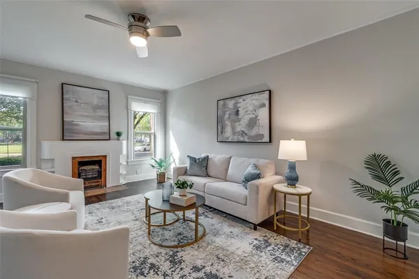 a living room with furniture and a fireplace