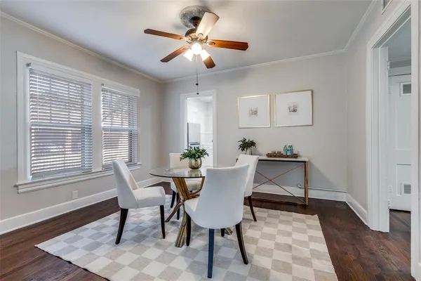 a view of a dining room with furniture and window