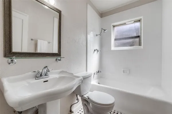 a bathroom with a sink toilet and bathtub