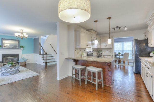a kitchen with a stove a sink and a refrigerator