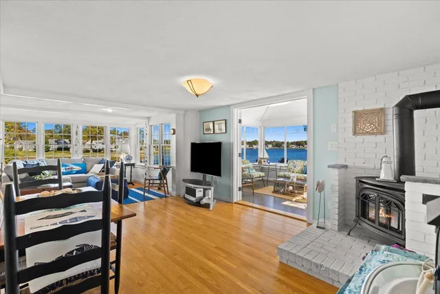 a view of a livingroom with furniture and a flat screen tv