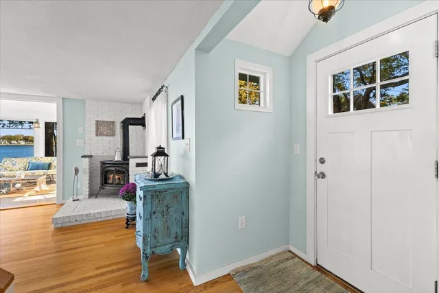 a dining room with furniture and wooden floor