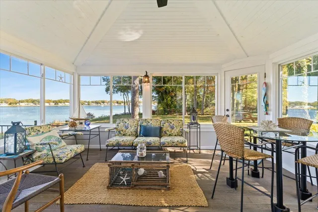 a bathroom with a granite countertop sink mirror vanity and toilet