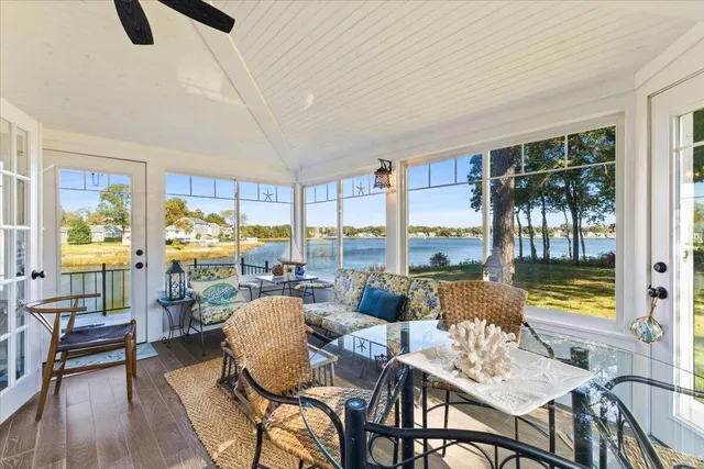 a bathroom with a bathtub and a window