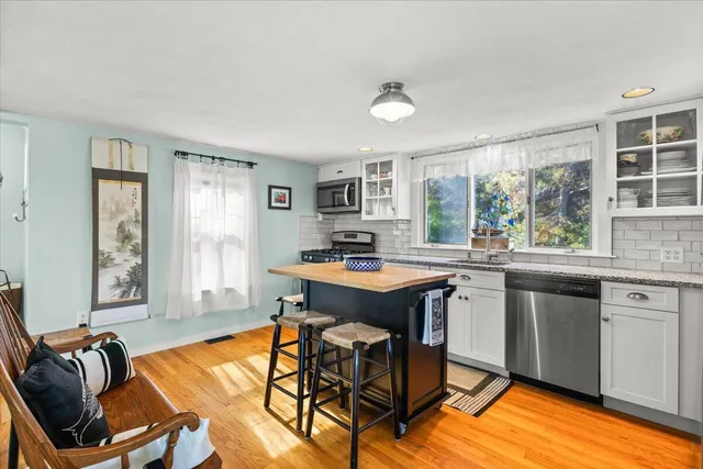 a bathroom with a sink a mirror and shower