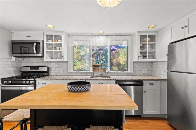 a bed room with a bed and a window