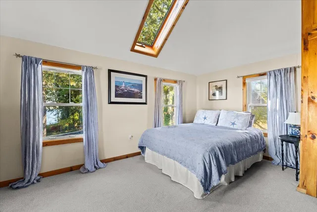 a view of a balcony with wooden floor and city view