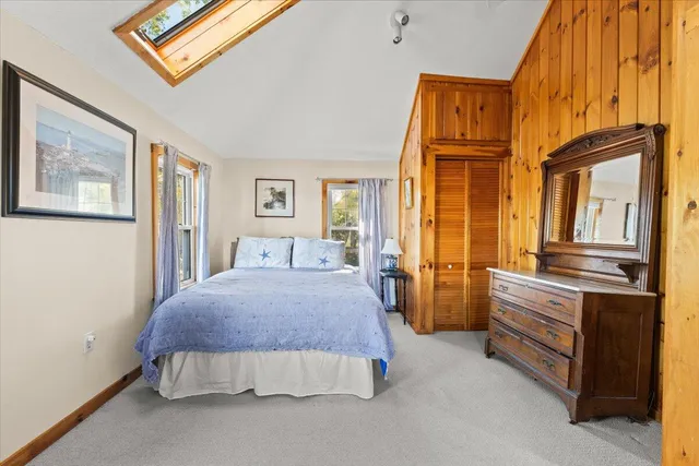 a view of a lake with a house in the background