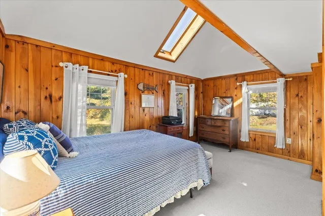 a view of a lake with houses in the back