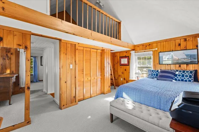 a view of a lake with houses in the back