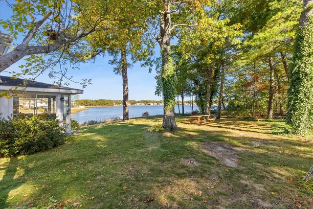 an aerial view of ocean residential houses with outdoor space and ocean view