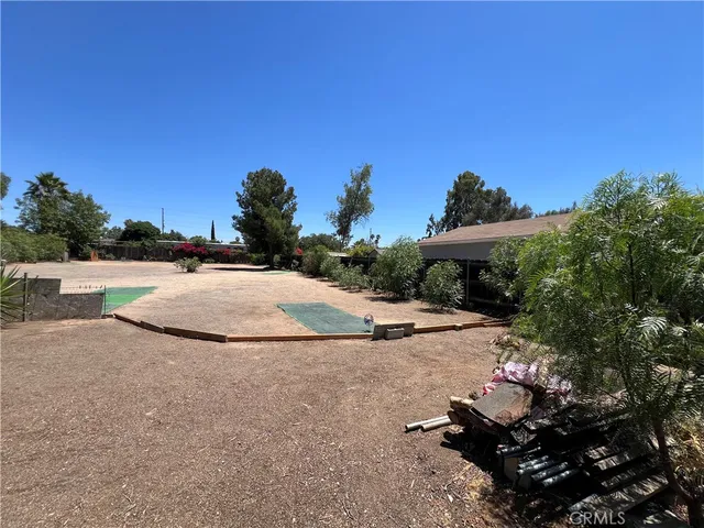 a view of a houses ground and a ocean view