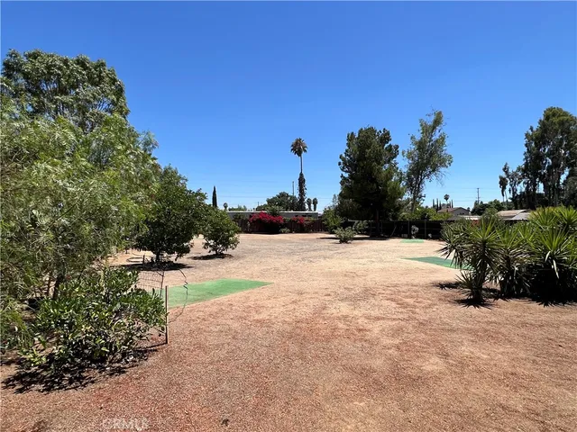 a view of a backyard of the house