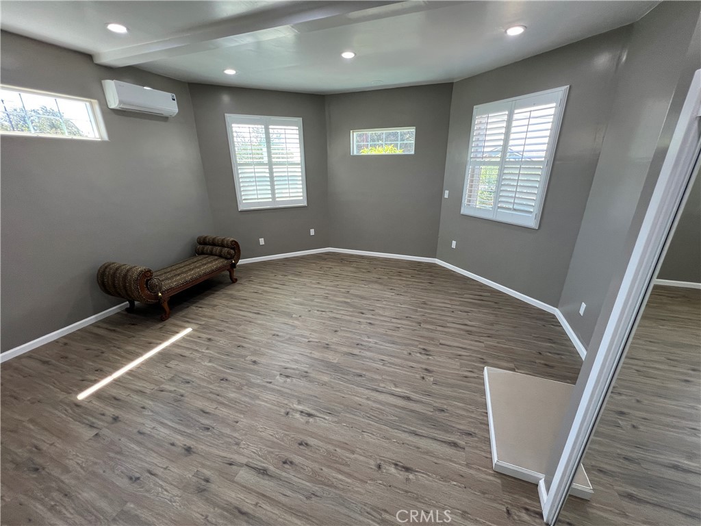 6952 Coolidge Avenue Riverside, CA 92506 - Photo 4 of 20 a view of empty room with wooden floor and fan