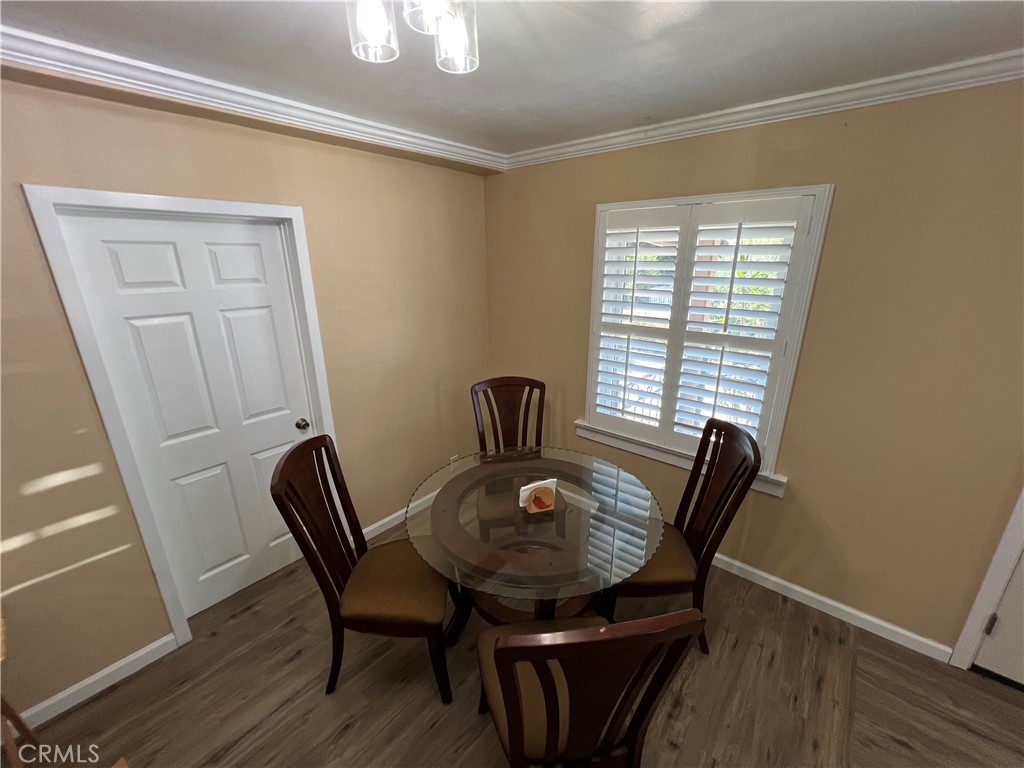 6952 Coolidge Avenue Riverside, CA 92506 - Photo 8 of 20 a view of a dining room with furniture window and wooden floor