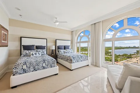 a bedroom with double bed and a large window
