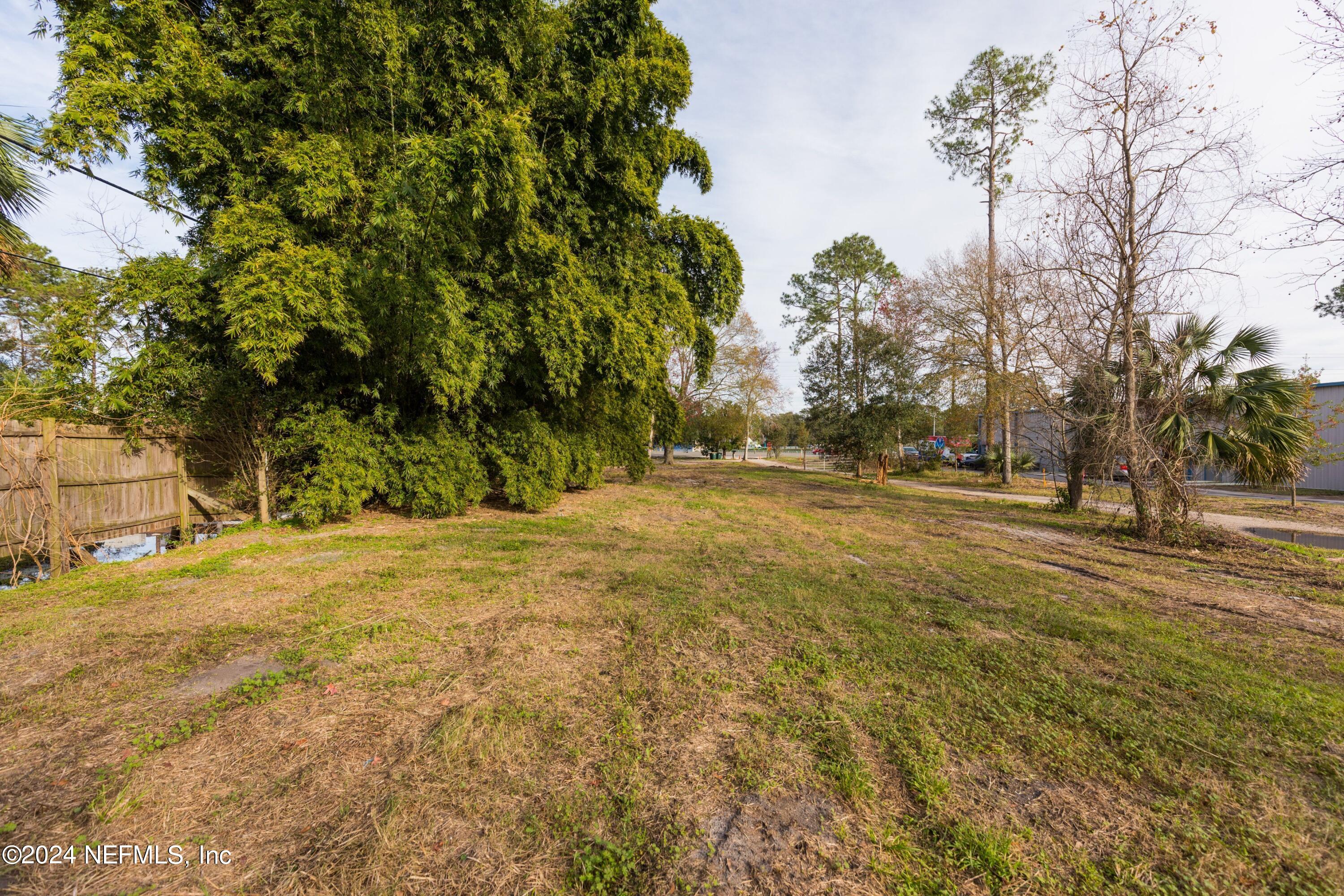 2168 St Johns Bluff Road South Jacksonville, FL 32246 - Photo 5 of 6 a view of outdoor space with trees