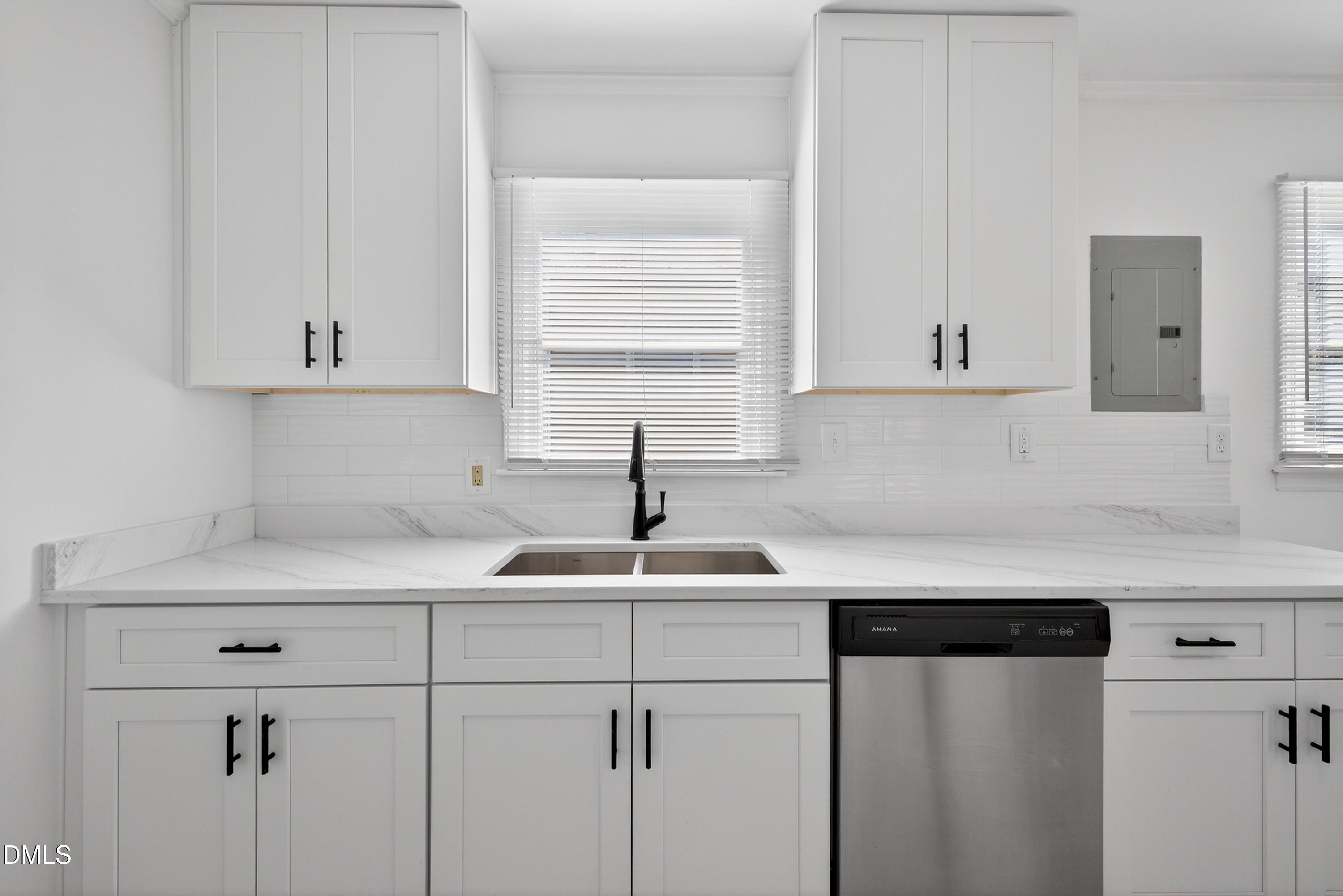 302 Normandy Street Durham, NC 27707 - Photo 13 of 29 a kitchen with a sink and cabinets