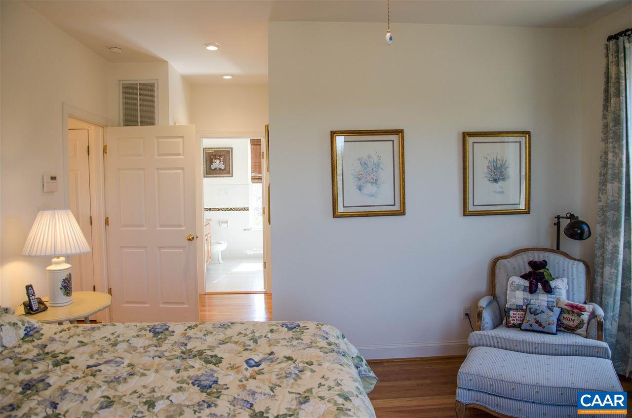 136 Fishpond Road Howardsville, VA 24562 - Photo 11 of 49 a bedroom with a bed and wooden floor