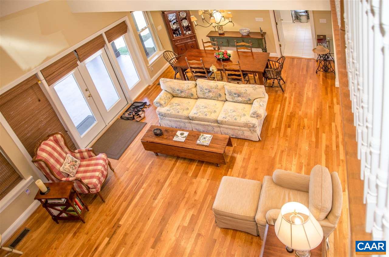 136 Fishpond Road Howardsville, VA 24562 - Photo 16 of 49 a balcony with chairs and wooden floor