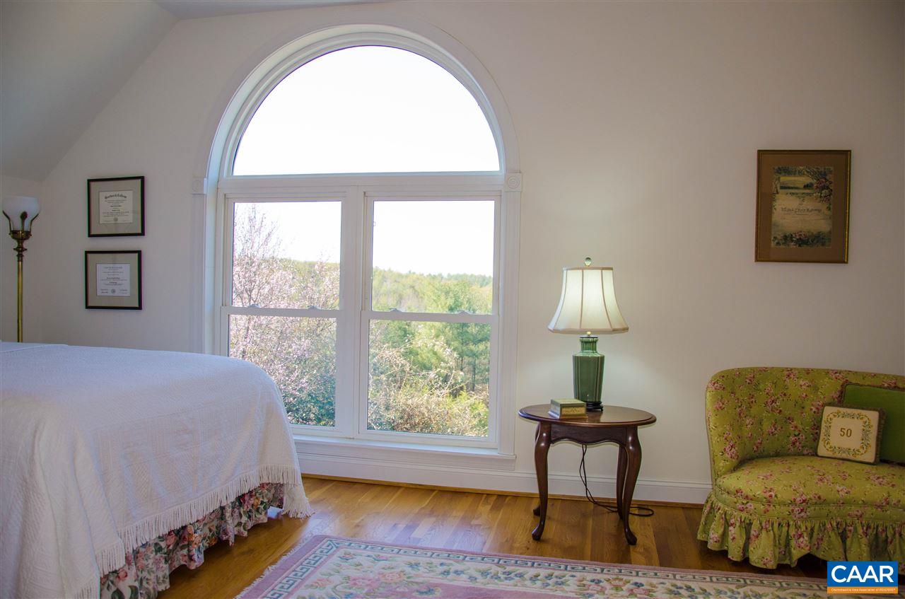 136 Fishpond Road Howardsville, VA 24562 - Photo 18 of 49 a bedroom with a bed and a window