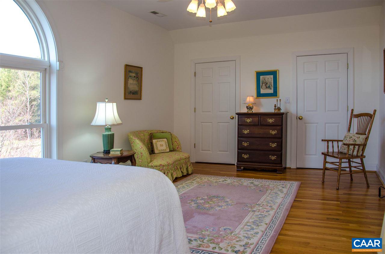 136 Fishpond Road Howardsville, VA 24562 - Photo 19 of 49 a bedroom with a bed and a table