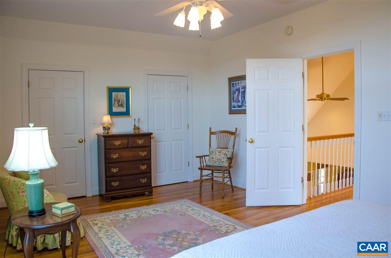 136 Fishpond Road Howardsville, VA 24562 - Photo 20 of 49 a living room with furniture a lamp and a window