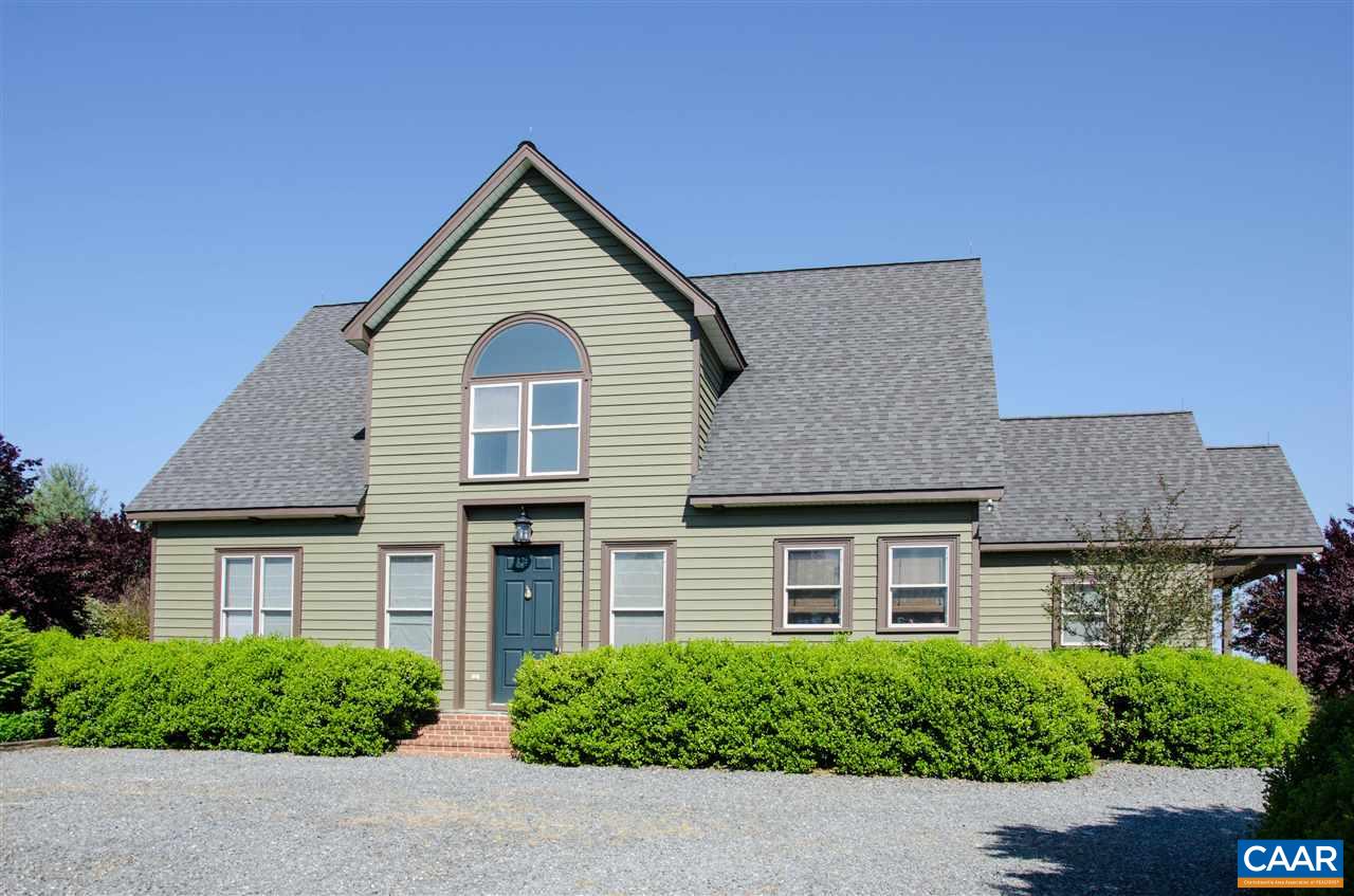 136 Fishpond Road Howardsville, VA 24562 - Photo 2 of 49 a front view of a house with a yard