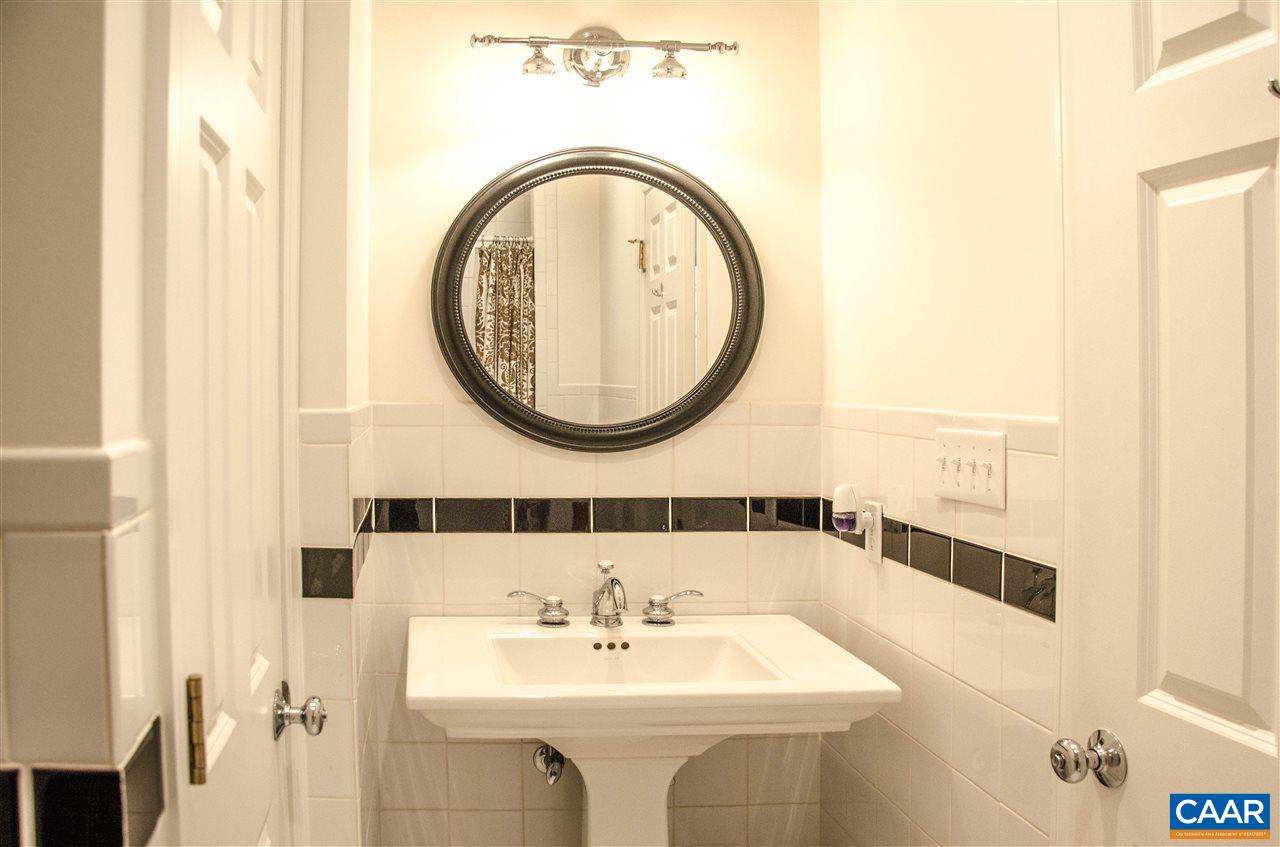 136 Fishpond Road Howardsville, VA 24562 - Photo 21 of 49 a bathroom with a sink and a mirror