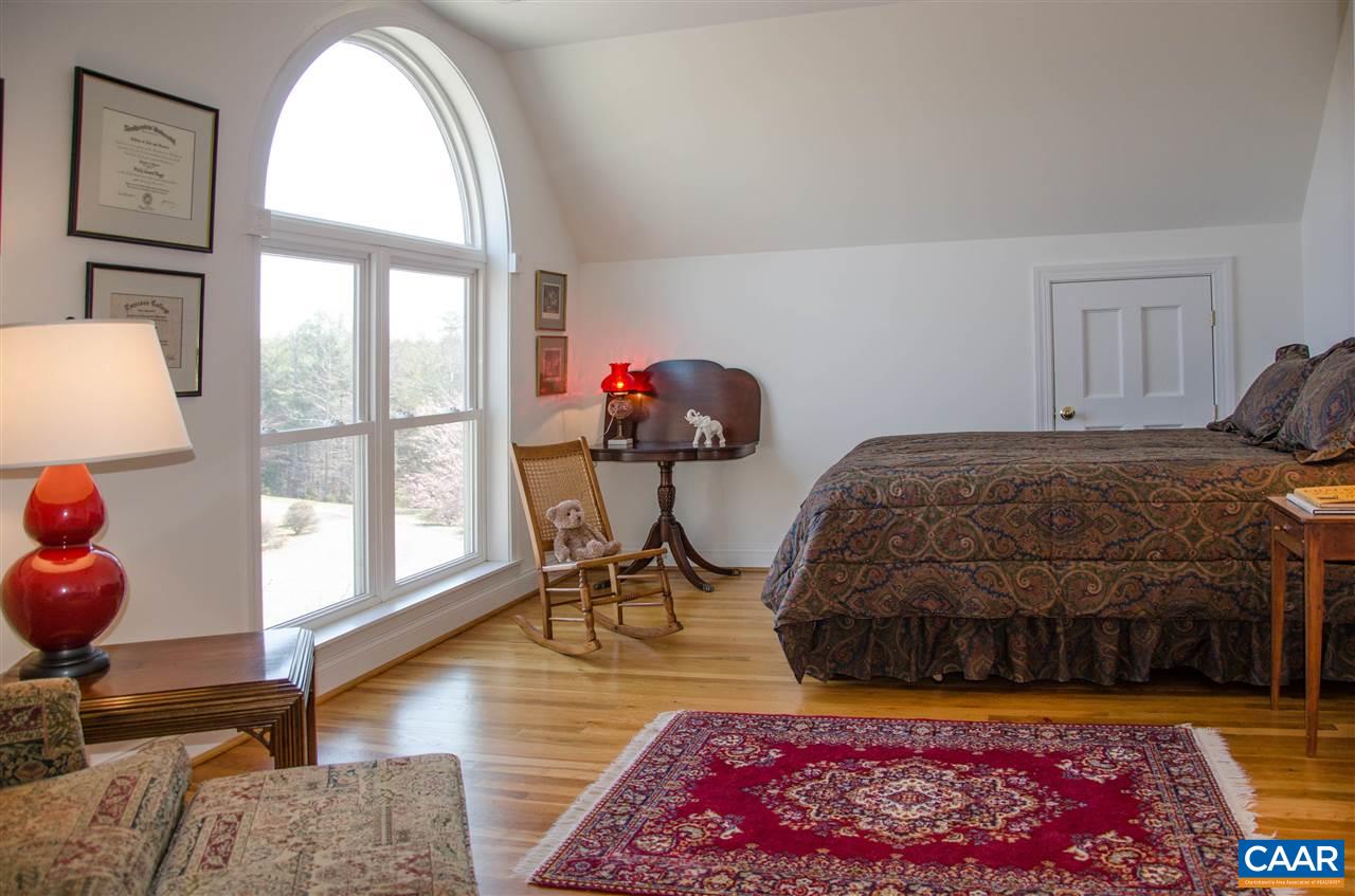 136 Fishpond Road Howardsville, VA 24562 - Photo 25 of 49 a bedroom with furniture and a window