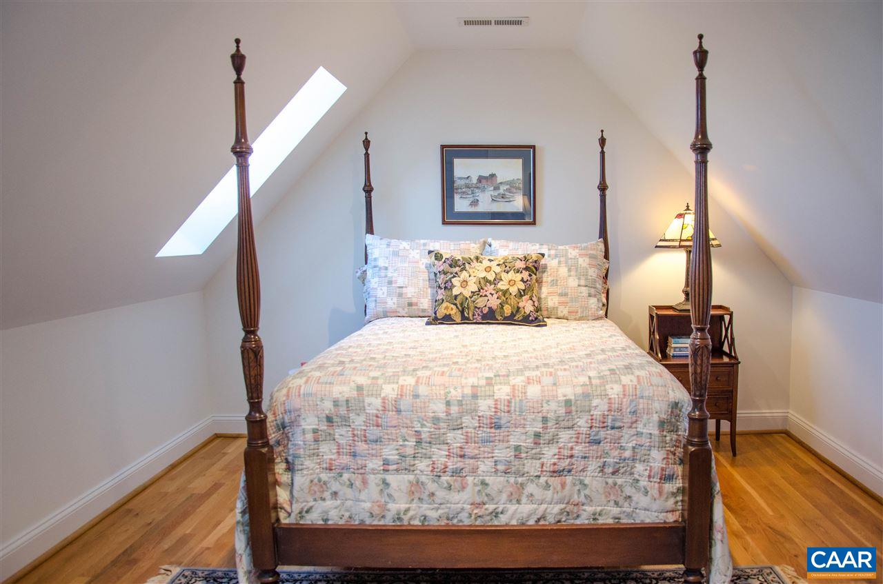 136 Fishpond Road Howardsville, VA 24562 - Photo 31 of 49 a bedroom with a bed and a painting on the wall