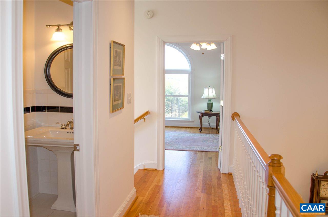 136 Fishpond Road Howardsville, VA 24562 - Photo 33 of 49 a view of a hallway with wooden floor and a living room