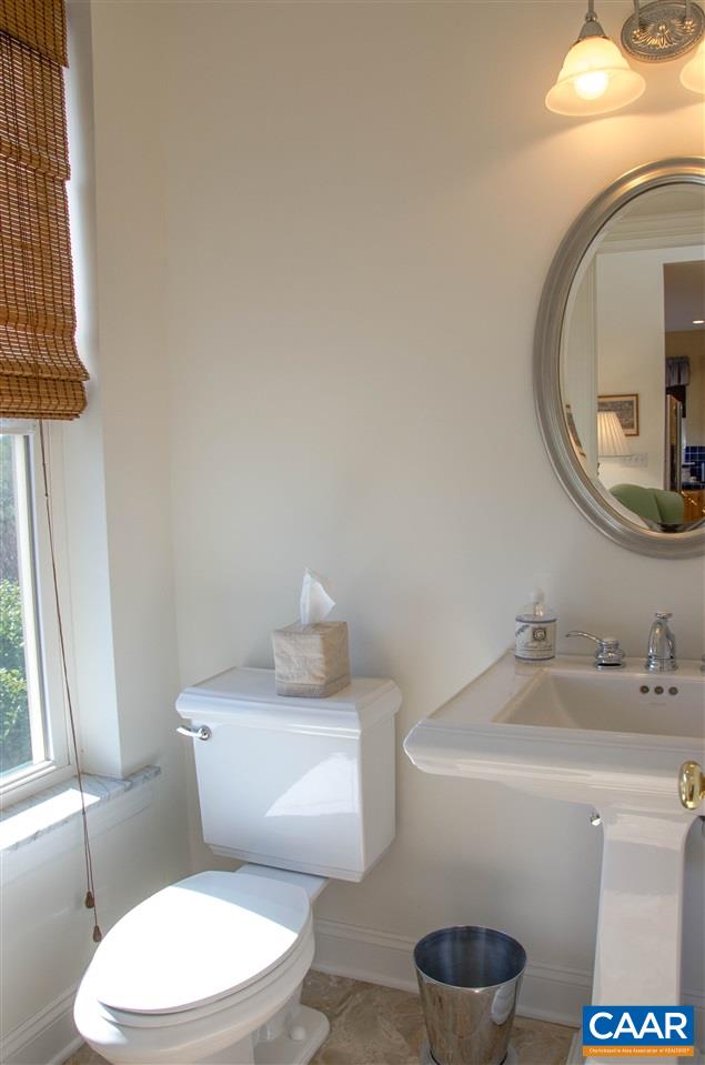 136 Fishpond Road Howardsville, VA 24562 - Photo 34 of 49 a white toilet sitting next to a bathroom sink