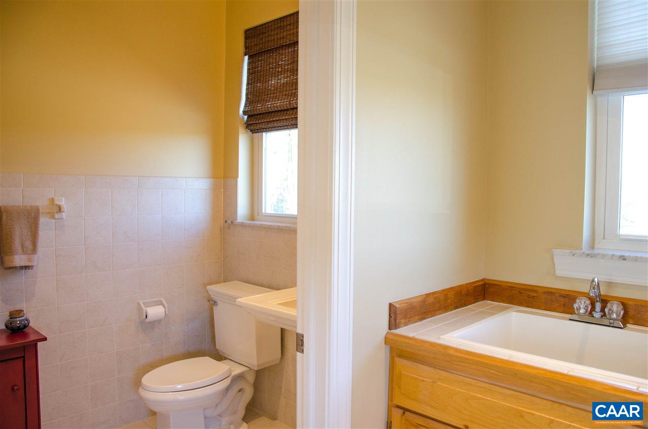136 Fishpond Road Howardsville, VA 24562 - Photo 35 of 49 a bathroom with a sink and a toilet