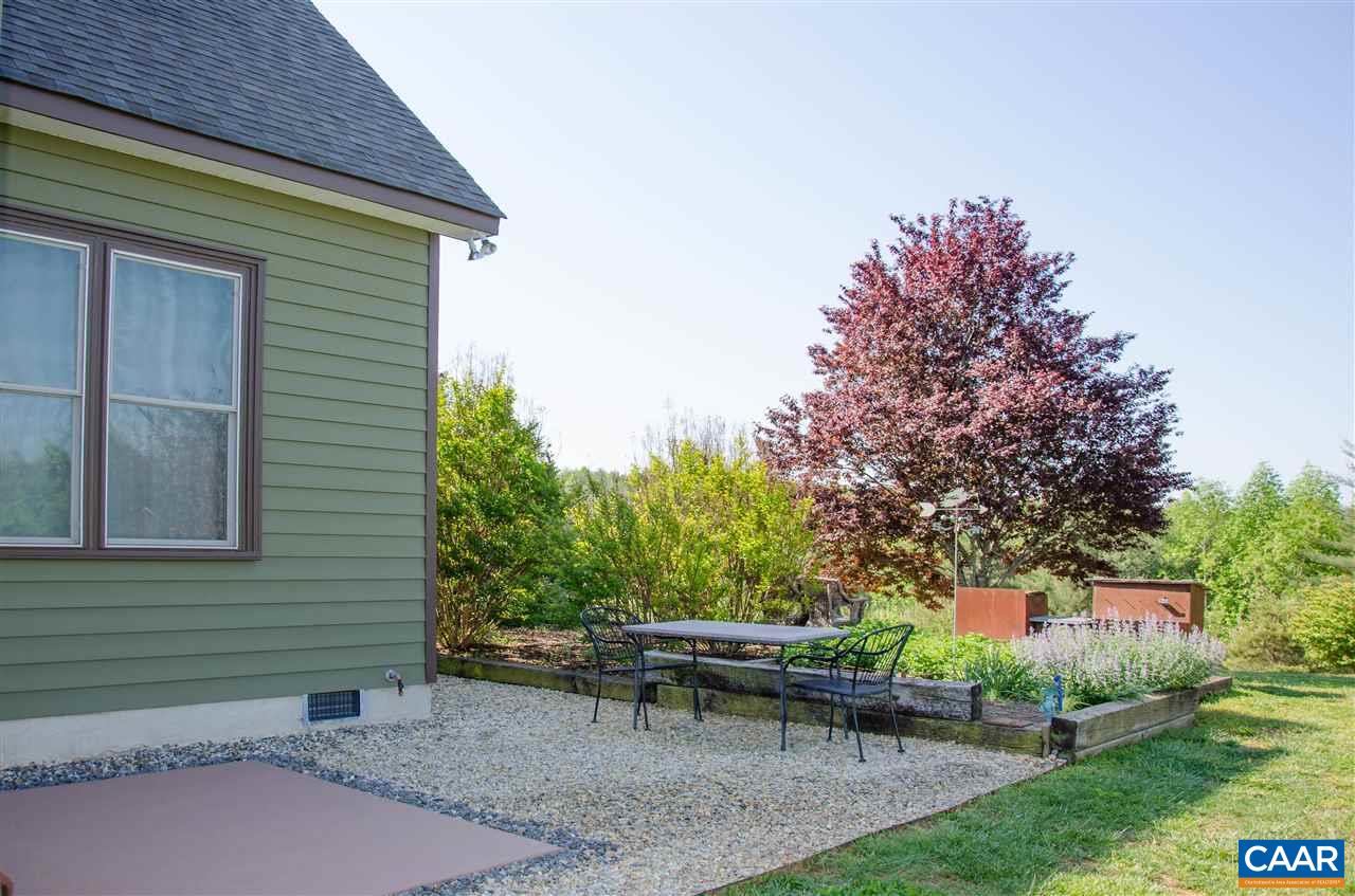 136 Fishpond Road Howardsville, VA 24562 - Photo 39 of 49 a backyard of a house with table and chairs