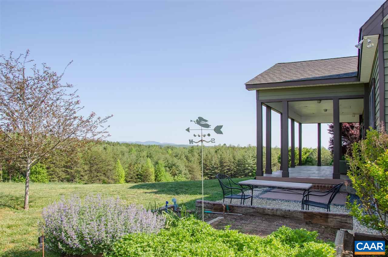 136 Fishpond Road Howardsville, VA 24562 - Photo 40 of 49 a backyard of a house with outdoor seating