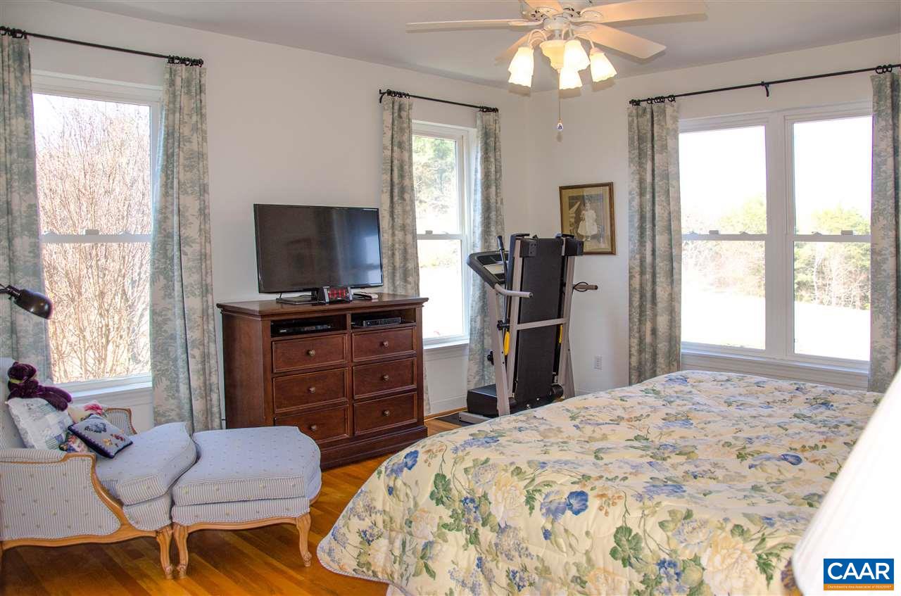 136 Fishpond Road Howardsville, VA 24562 - Photo 10 of 49 a bedroom with a bed and a flat screen tv