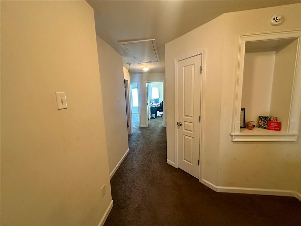 2655 Avanti Way Decatur, GA 30035 - Photo 6 of 12 a view of a hallway with wooden floor